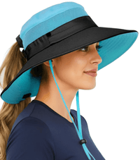 Woman wearing the GearTOP Navigator Ponytail Series aqua blue and black sun protection hat featuring a ponytail hole, UPF 50+ wide brim, breathable mesh ventilation, water-resistant nylon fabric, and adjustable chin cord for outdoor activities.