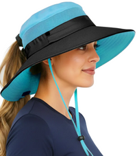 Woman wearing the GearTOP Navigator Ponytail Series blue wide brim sun hat with ponytail hole, breathable mesh side panels, UPF 50+ sun protection, and adjustable chin cord for hiking, fishing, camping, and beach use.
