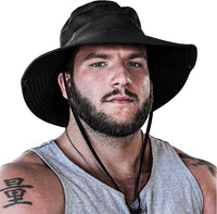 Man wearing the black GearTop Navigator Series wide brim UPF 50+ sun hat with breathable mesh panels and adjustable chin strap for hiking, fishing, and outdoor adventures.