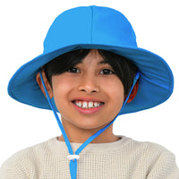 Front-facing view of a child wearing the blue GearTOP Voyager kids sun hat with adjustable chin strap and wide brim sun coverage.
