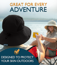 Couple relaxing by the water while wearing the GearTOP Floater Series waterproof UPF 50+ sun hats, designed with breathable mesh ventilation, wide brim coverage, and secure adjustable fit for every outdoor adventure.