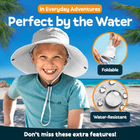Child wearing light gray GearTOP kids sun hat at the beach with foldable design and water-resistant fabric for outdoor use