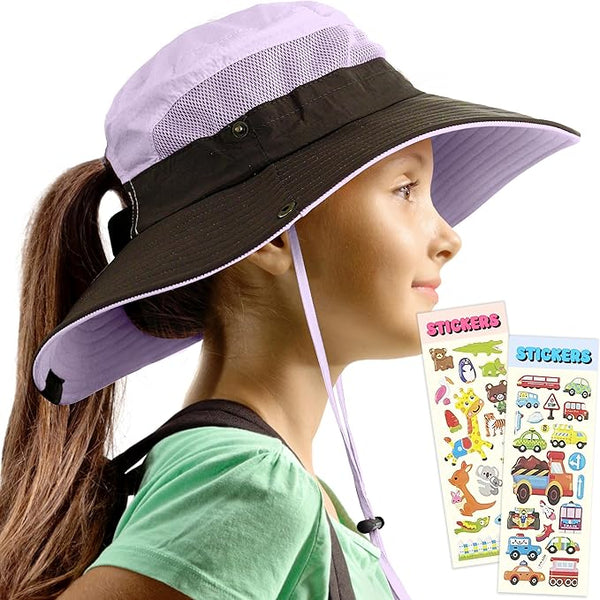 Girl wearing lavender GearTOP sun hat for kids with ponytail hole, mesh panels, and colorful stickers, side view.