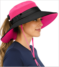 Side view of a woman wearing the GearTOP Navigator Ponytail Series light pink and black women's sun hat with a ponytail opening, UPF 50+ UV protection, wide brim, breathable mesh panels, and adjustable chin strap for hiking, fishing, gardening, and beach adventures.