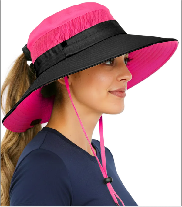 Woman wearing the GearTOP Navigator Ponytail Series hot pink wide brim sun hat with UPF 50+ protection, breathable mesh panels, ponytail opening, and adjustable chin strap for hiking, fishing, gardening, and beach adventures.