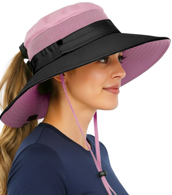 Side profile of a woman wearing the GearTOP Navigator Ponytail Series light pink sun hat featuring UPF 50+ UV protection, wide brim coverage, breathable mesh ventilation, ponytail opening, and adjustable fit for outdoor activities.