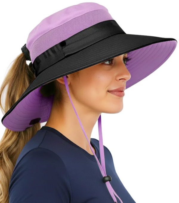 Woman wearing the GearTOP Navigator Ponytail Series purple safari sun hat with UPF 50+ UV protection, wide brim, ponytail-friendly design, breathable mesh panels, and adjustable chin strap for outdoor adventures.