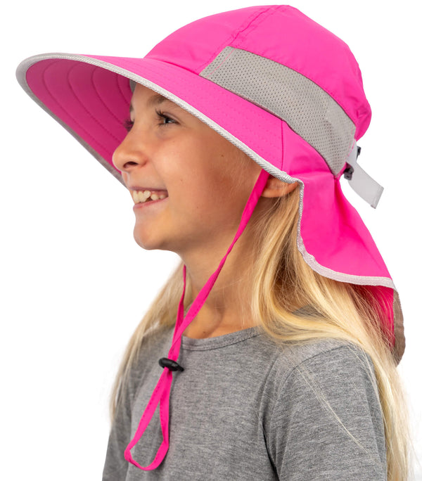 Girl wearing pink kids sun hat with wide brim and neck flap for UV protection outdoors
