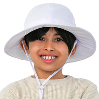 Front view of a child wearing the white GearTOP Voyager kids sun hat with wide brim and UPF 50+ sun protection.